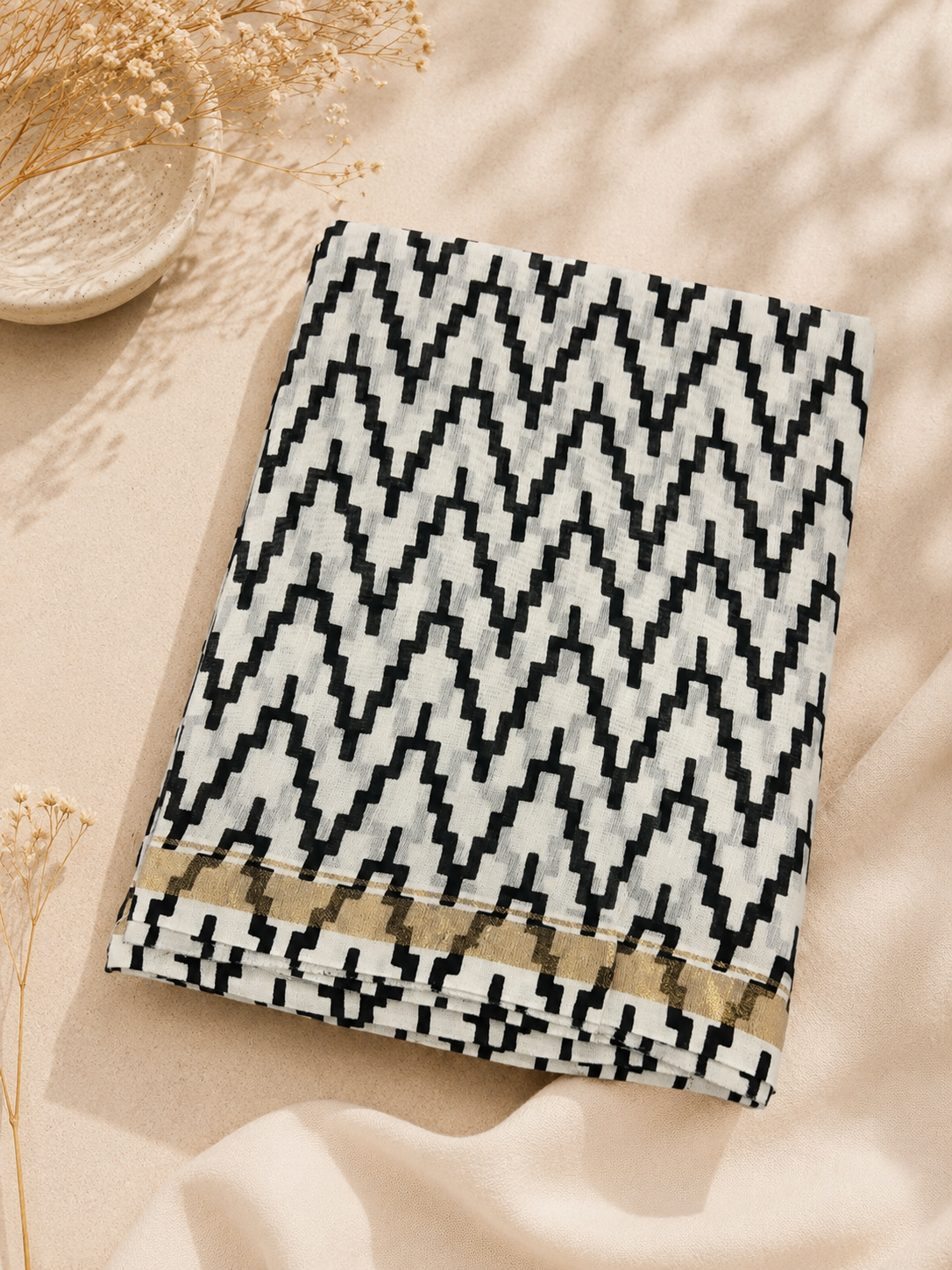 Folded Black Hand Block Printed Chanderi Suit Set with elegant zari border on a beige handcrafted background