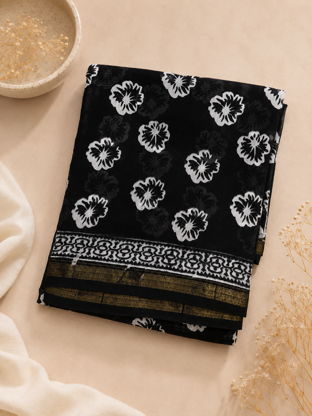 Close-up of Black Hand Block Printed Chanderi Suit fabric showcasing traditional floral print and zari border details