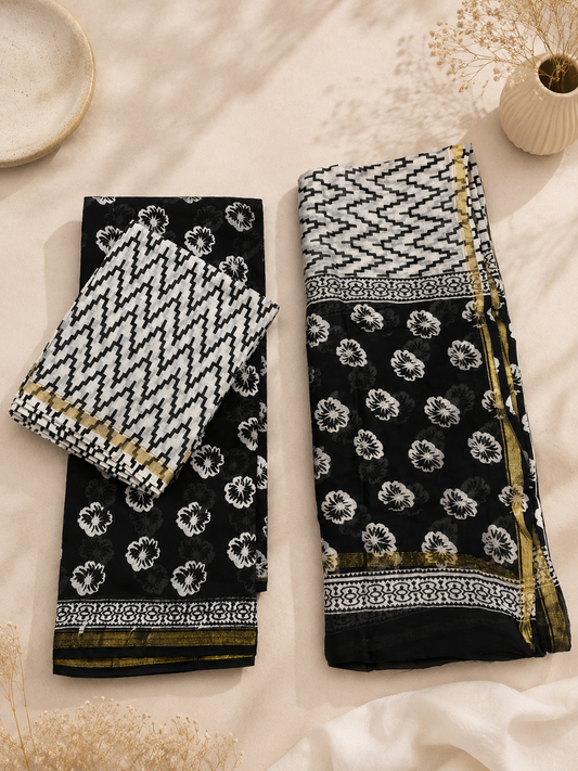 Black Hand Block Printed Chanderi Suit Set with Zari Border hanging on a wooden hanger, handcrafted by women artisans from India