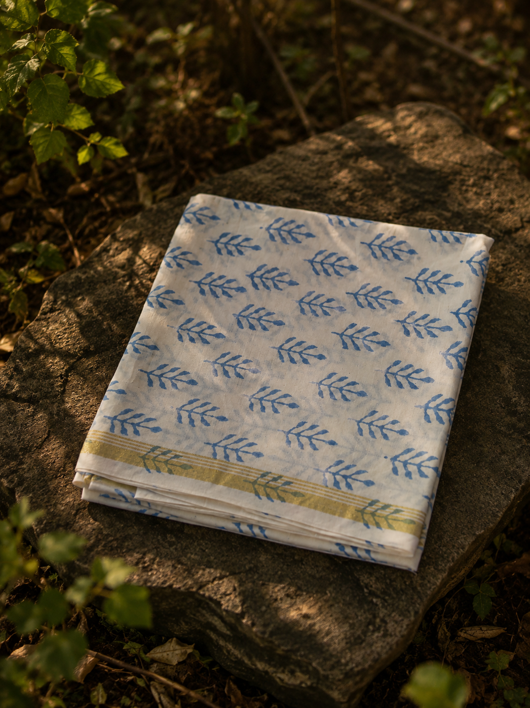 Premium blue handcrafted Chanderi suit set with floral block print, kurta, bottom and dupatta.
