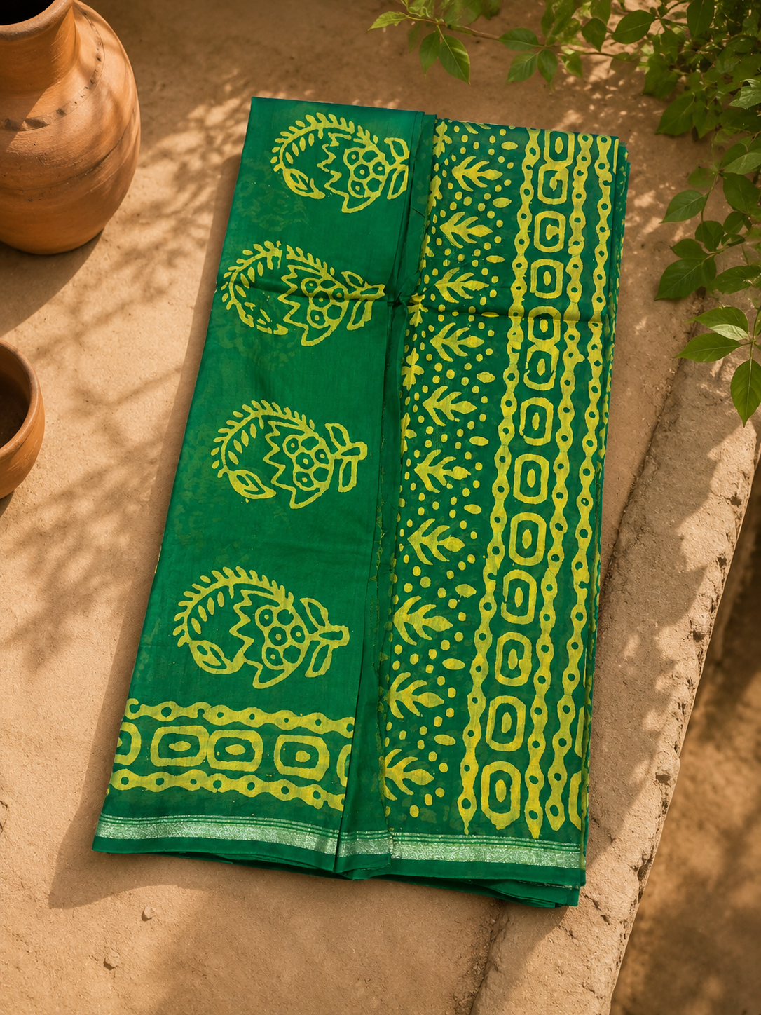 Premium green Chanderi suit set featuring handcrafted block print design and elegant zari border.