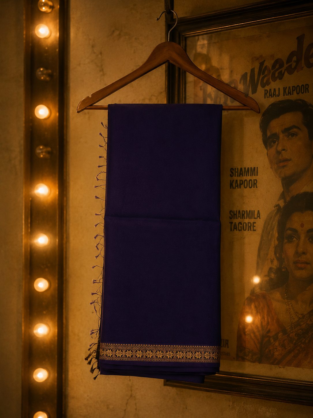 Royal purple handwoven Chanderi saree featuring elegant gold zari border and fine woven stripe detailing.